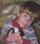Jay holding baby Dutch rabbit 1978